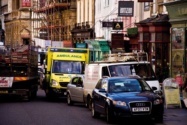 Ambulance in crowded street