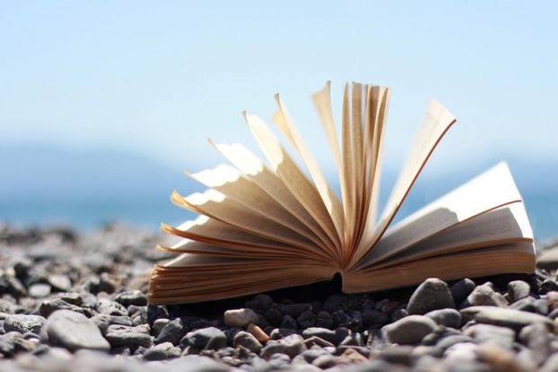 An open book on a beach