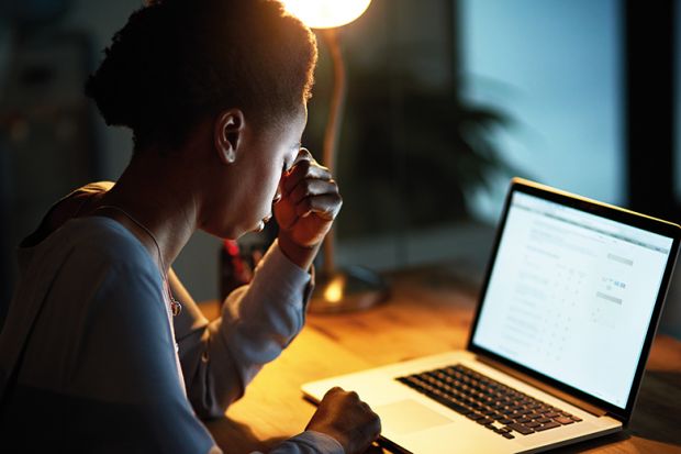 Black woman working on laptop