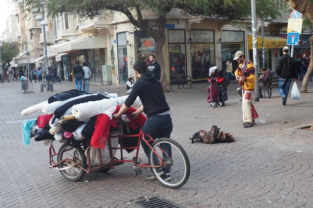 Bike transporting rolls of fabric