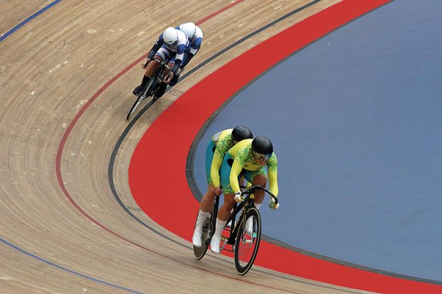 Two tandem teams race on cycle track