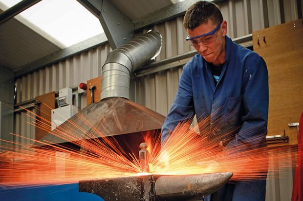 Blacksmith hitting anvil