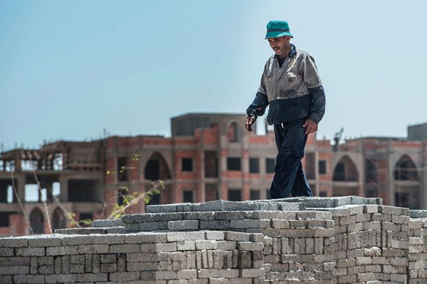 Man with bricks