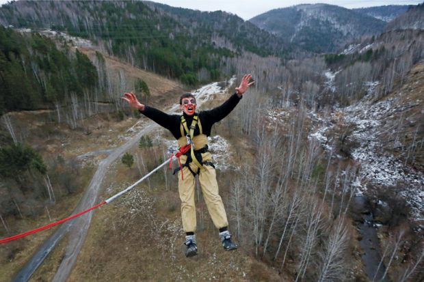 Bungee jumper yelling while leaping