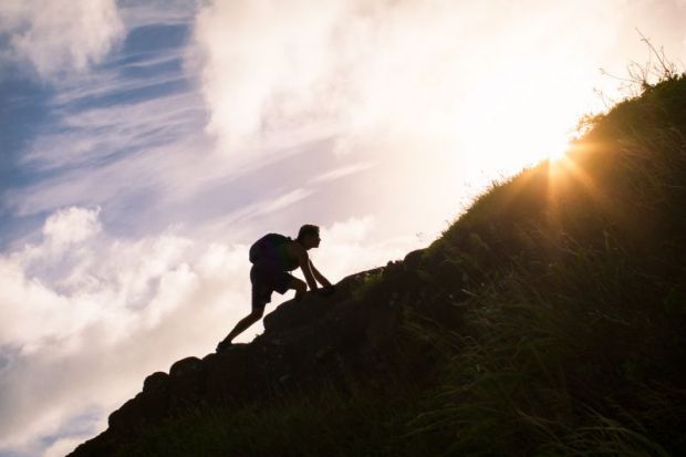 Person climbing a slope