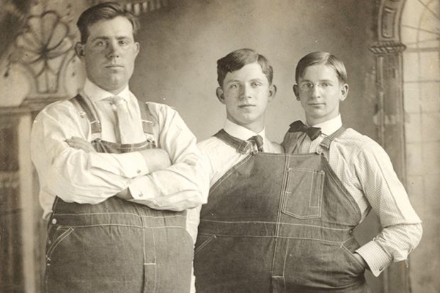 Two men close together wearing same clothes