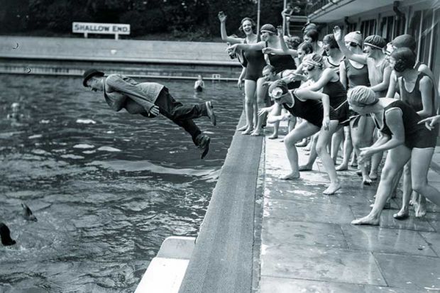 clothed-man-dive-pool