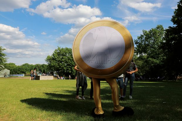 Person dressed as euro coin