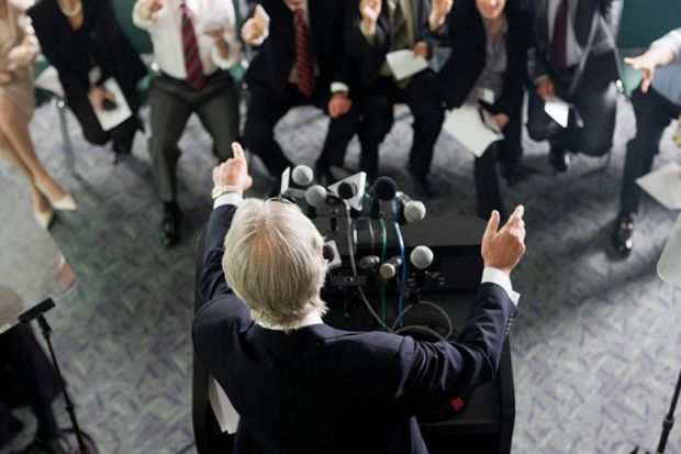 A man speaking at a news conference