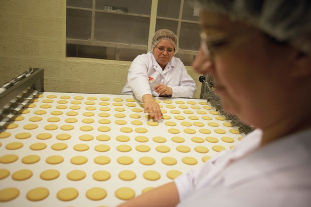 Bakers with biscuits