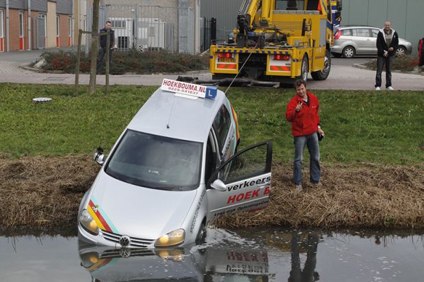 Car at edge of lake