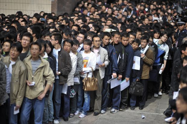 Crowd of graduates waiting for job fair, China