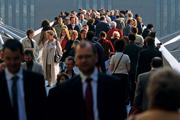 Crowd of people on Millennium Bridge, London