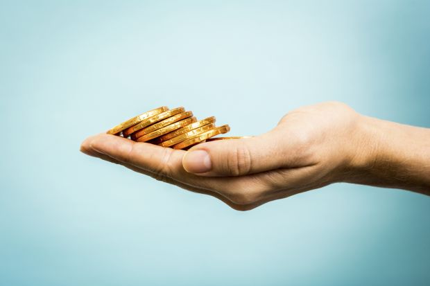 hand holding coins