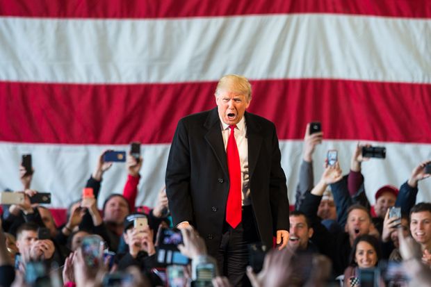 Donald Trump speaks in front of a crowd