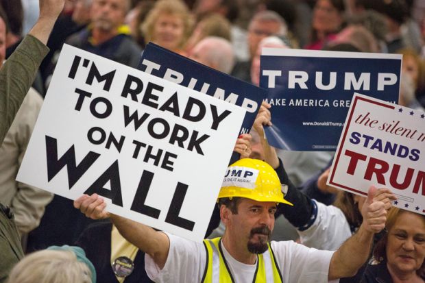 Donald Trump supporters holding placards