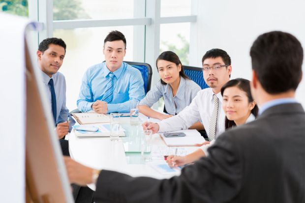 employees and interns in asian office