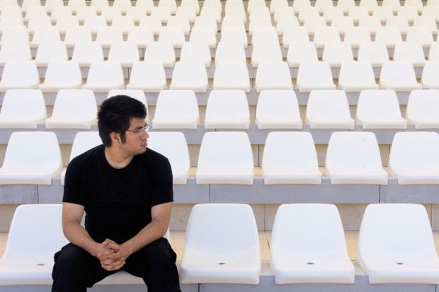 Man in empty stadium