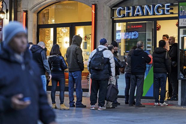 people queuing for currency at a bureau de change