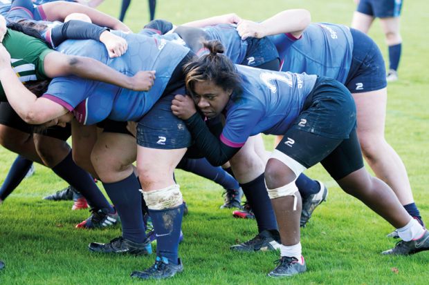 Female rugby player in scrum