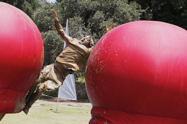 Gameshow contestant falling into mud pit