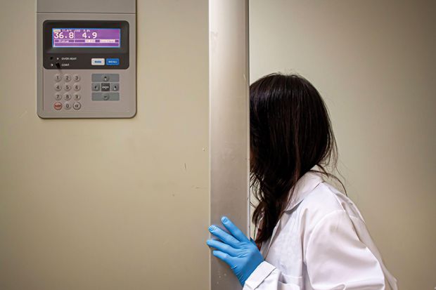 A female science student hides her face