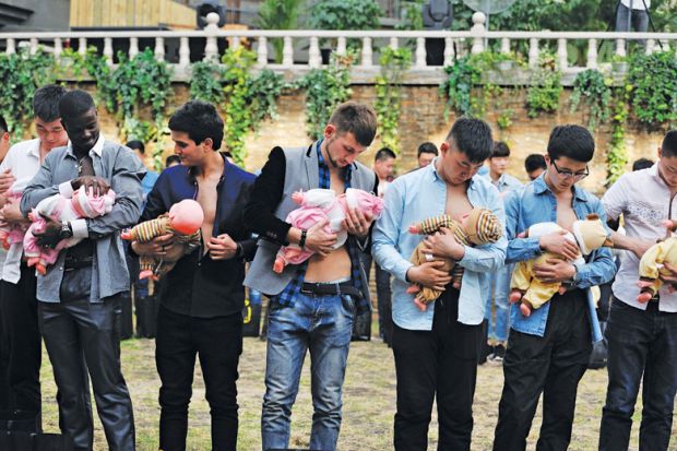 Group of men learning about breastfeeding