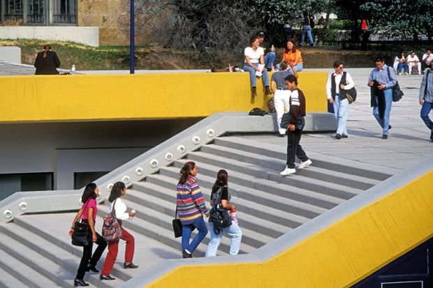 Students walking up stairs on campus