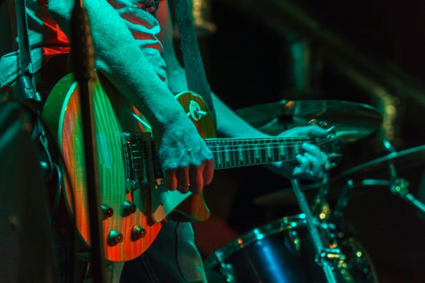 An electric guitar and drums