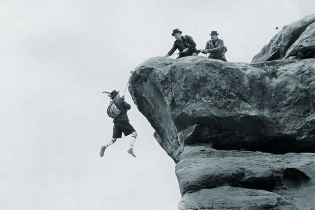 hanging from cliff face