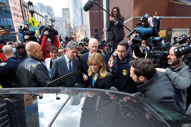 Felicity Huffman leaves the federal courthouse after facing charges in a nationwide college admissions cheating scheme