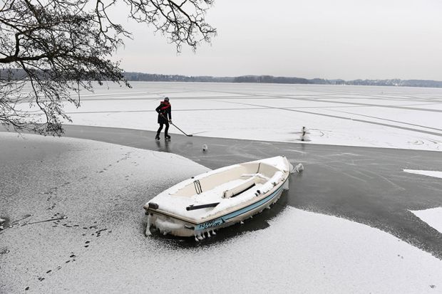 practising hockey on frozen lake