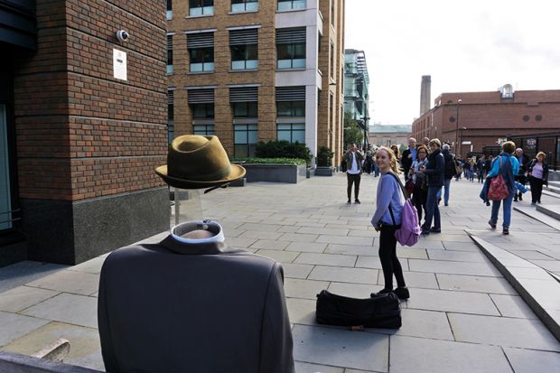 Street entertainer dressed as the Invisible Man, London, England