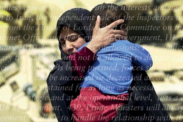 Iraqi woman holding and protecting child in front of army tanks