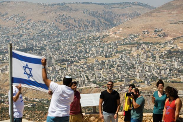 Israelis with flag of Israel