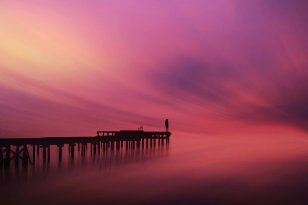 A beautiful and colourful photo of a figure on a pontoon. Macro analysis of photographs can lead to higher-level thinking in HE and should not be overlooked.