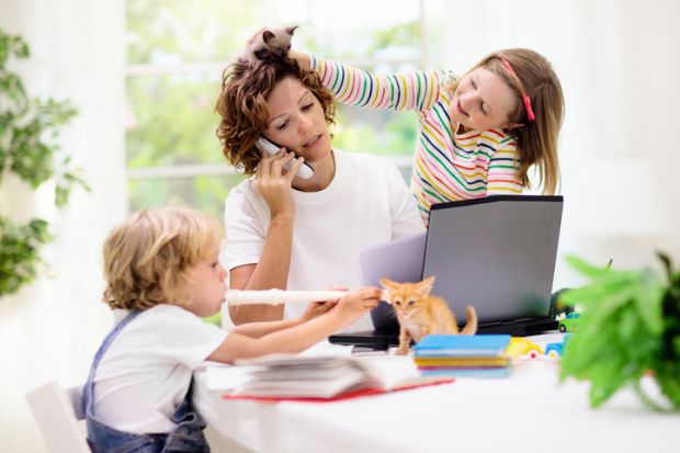 Woman working home with kids