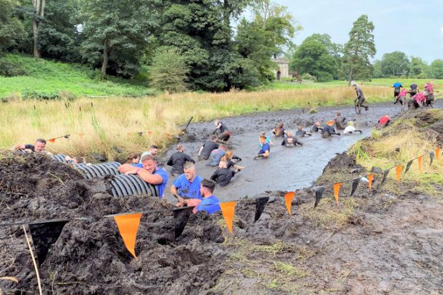 Participants in a 'Tough Mudder' event