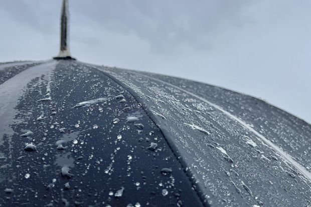 Close up of umbrella in the rain