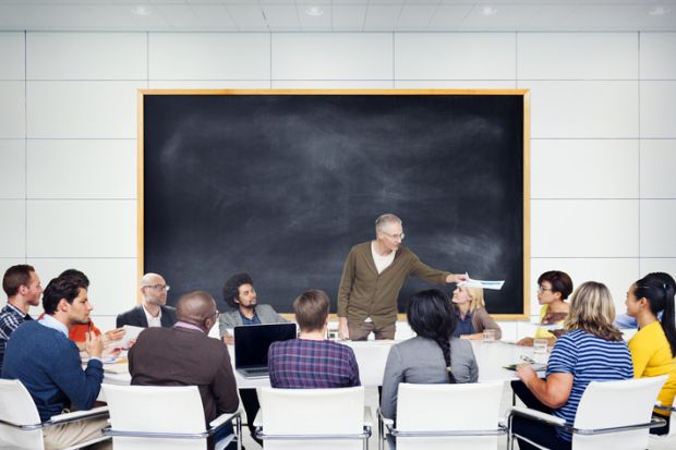 Students gathered around professor