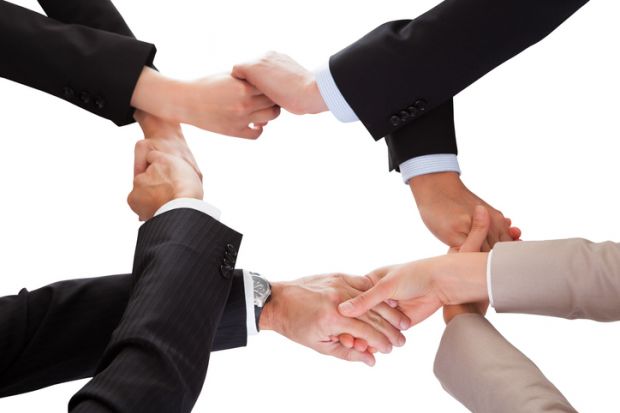 Intertwined handshakes symbolising overlap in interests and academic collaboration