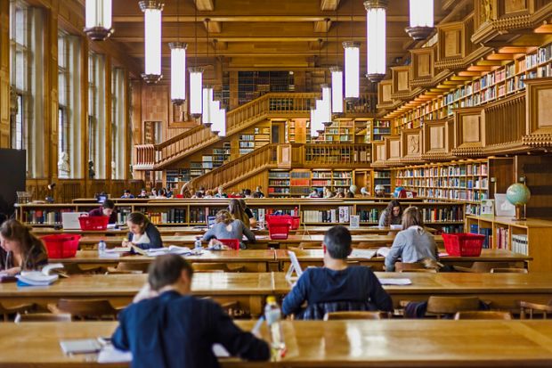 Wooden-panelled interior of a library