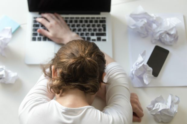 A woman falling asleep at her desk. Is the requirement for academics to constantly learn new skills going to burn them out?