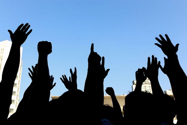 Group of people protesting or marching