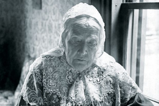 Julia Ward Howe writing at desk, 1906