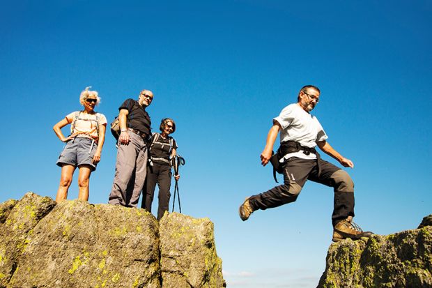 Man jumping across rocks