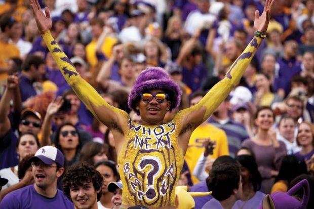 Louisiana State University student celebrating at American football game