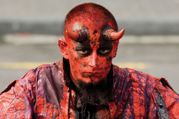 Man dressed as the devil/satan