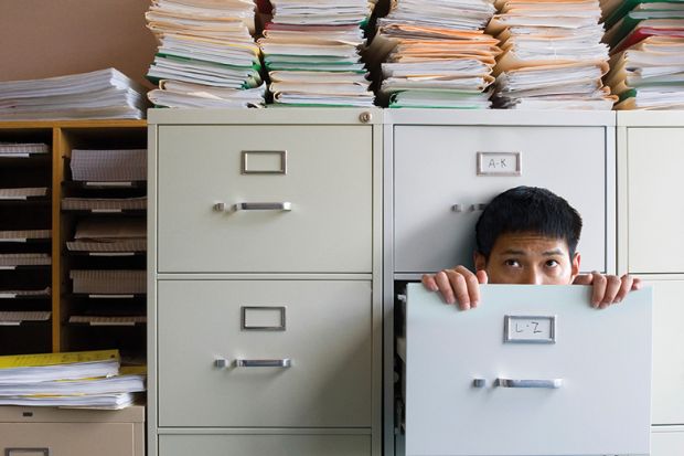 Man in a filing cabinet