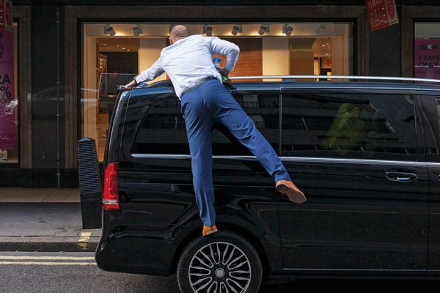 Man polishes the roof of his car